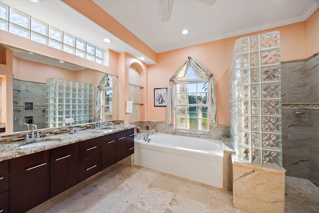 bathroom featuring a garden tub, double vanity, walk in shower, and a sink