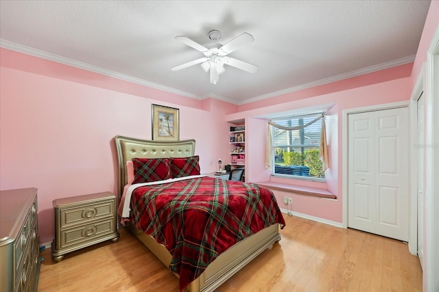 bedroom featuring light wood-style flooring, baseboards, and crown molding