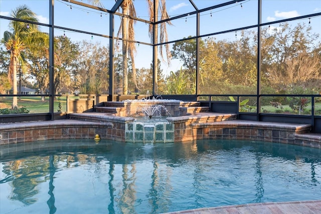 pool featuring a lanai and a hot tub