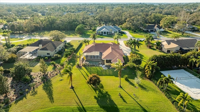 drone / aerial view featuring a forest view