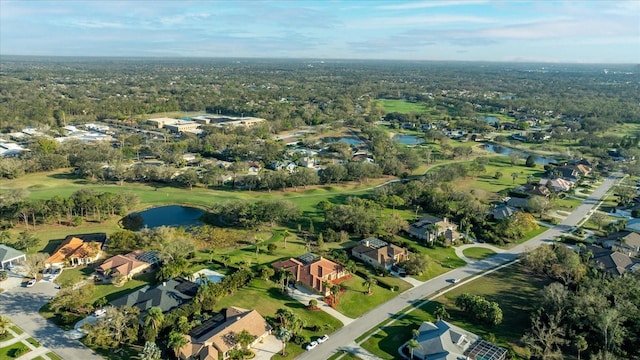 birds eye view of property featuring a water view, view of golf course, and a residential view