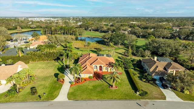 drone / aerial view with a water view