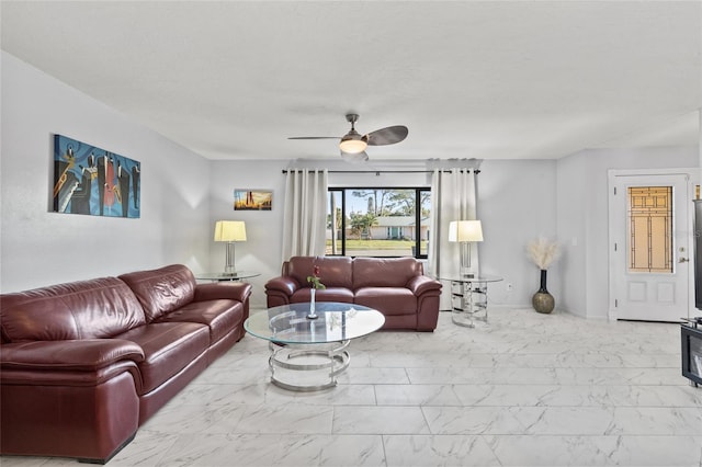 living room with marble finish floor and ceiling fan