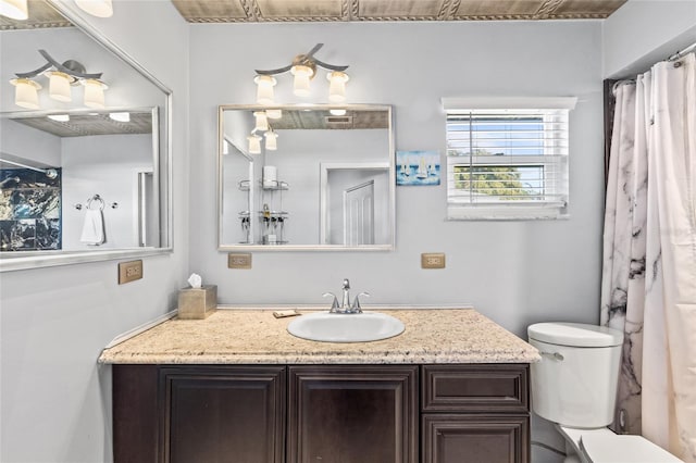 bathroom with toilet and vanity