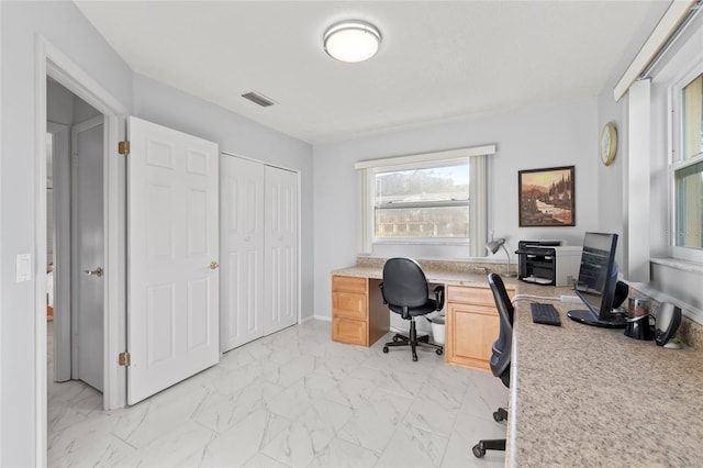 home office with marble finish floor, baseboards, and visible vents