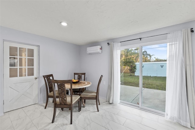 dining space featuring a wall unit AC, marble finish floor, a textured ceiling, and recessed lighting