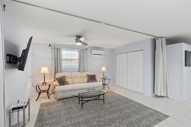 living area featuring ceiling fan, marble finish floor, and a wall mounted AC