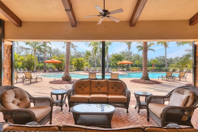 view of patio / terrace featuring ceiling fan, a community pool, and an outdoor hangout area