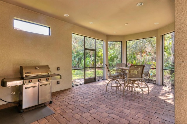 sunroom / solarium featuring plenty of natural light