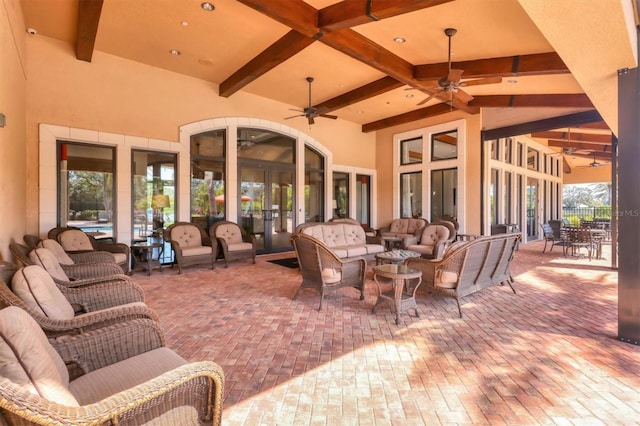 view of patio / terrace with an outdoor living space and a ceiling fan