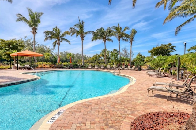 pool featuring a patio and a gazebo