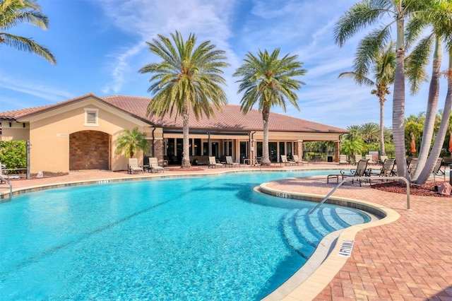 community pool featuring a patio area