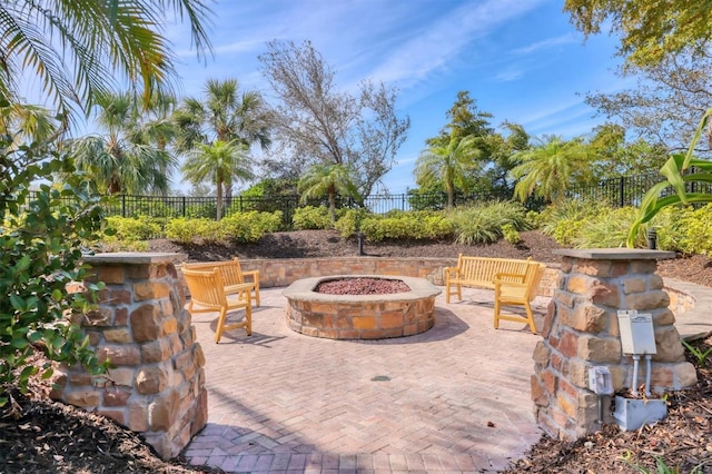 view of patio / terrace with a fenced backyard and a fire pit