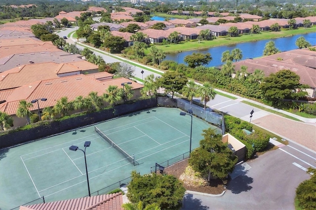 birds eye view of property with a residential view and a water view