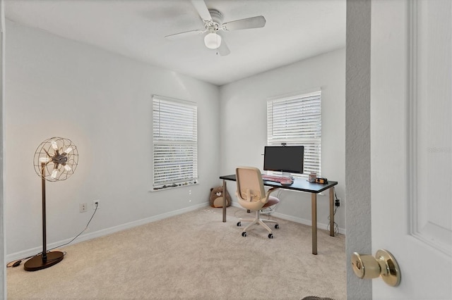 carpeted office featuring ceiling fan and baseboards