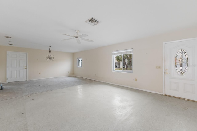 empty room with baseboards, visible vents, and ceiling fan