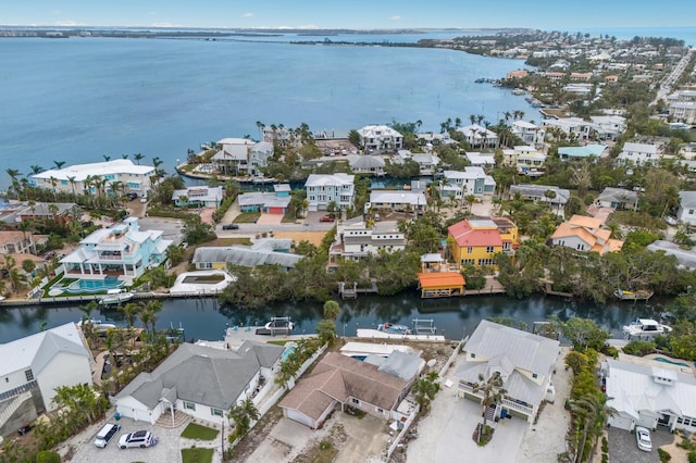 drone / aerial view featuring a water view and a residential view