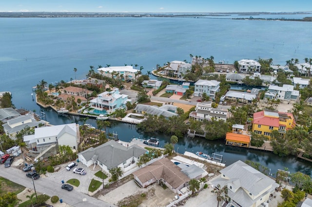 birds eye view of property with a residential view and a water view