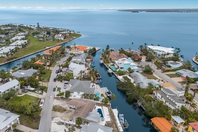 birds eye view of property featuring a water view and a residential view