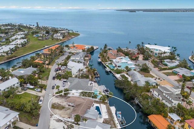 drone / aerial view with a water view and a residential view