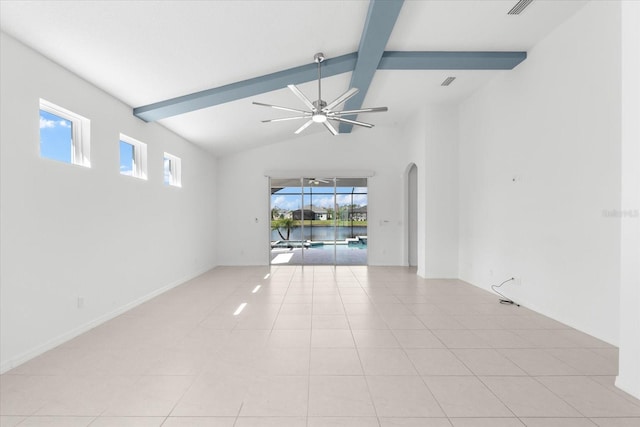 empty room featuring ceiling fan, light tile patterned floors, lofted ceiling with beams, visible vents, and baseboards