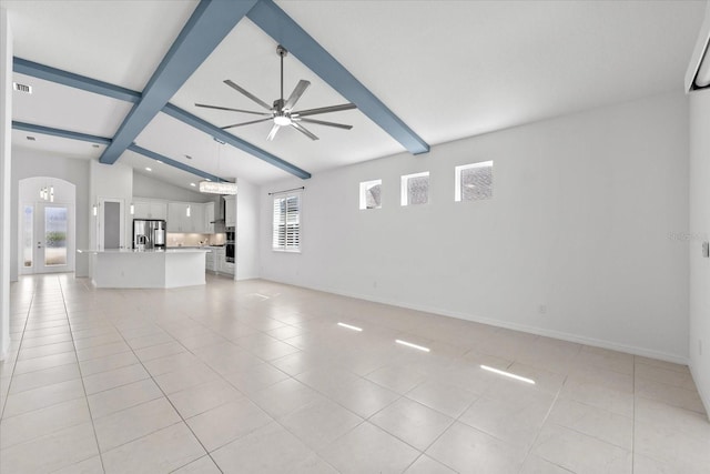 unfurnished living room featuring vaulted ceiling with beams, light tile patterned flooring, arched walkways, and a ceiling fan