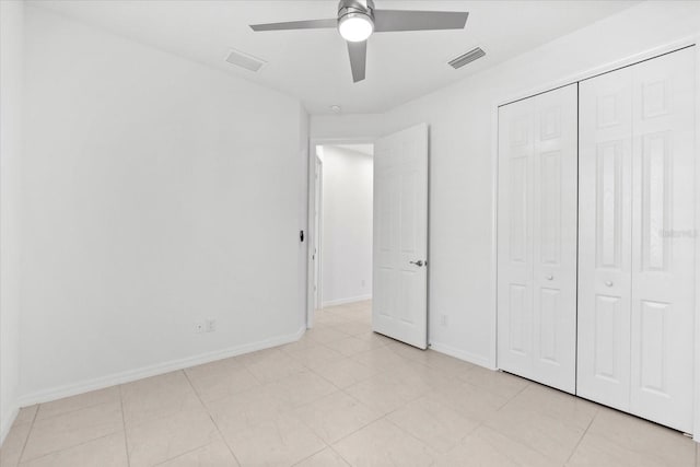 unfurnished bedroom featuring a ceiling fan, a closet, visible vents, and baseboards