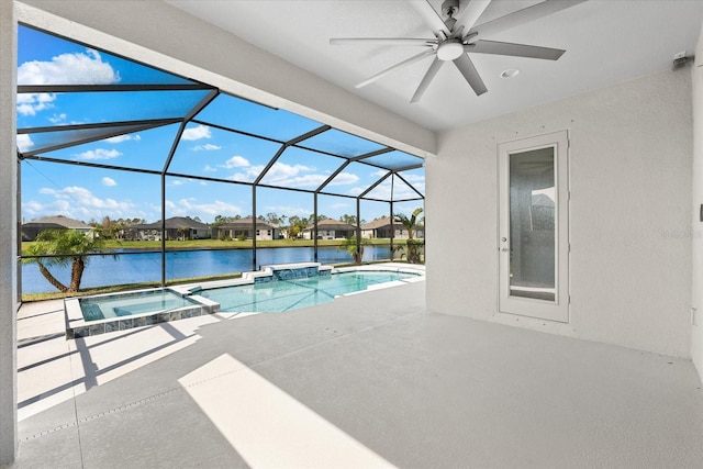 view of swimming pool featuring a patio, a water view, a lanai, and a pool with connected hot tub