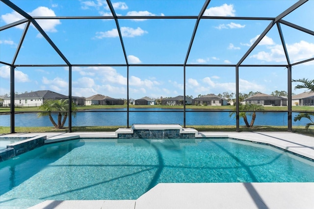 view of pool featuring a lanai, a water view, a pool with connected hot tub, and a residential view