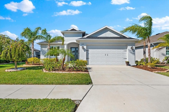 ranch-style home with driveway, a front lawn, an attached garage, and stucco siding