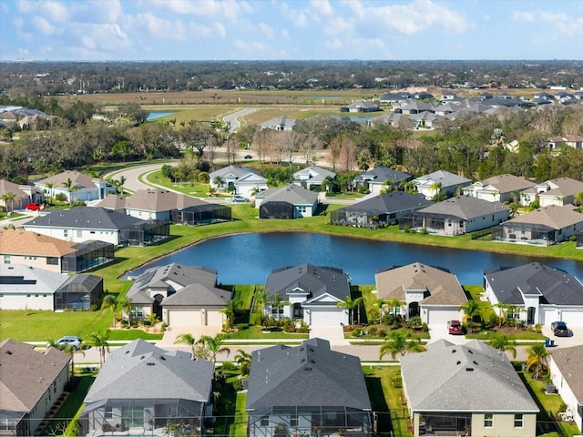 aerial view featuring a residential view and a water view