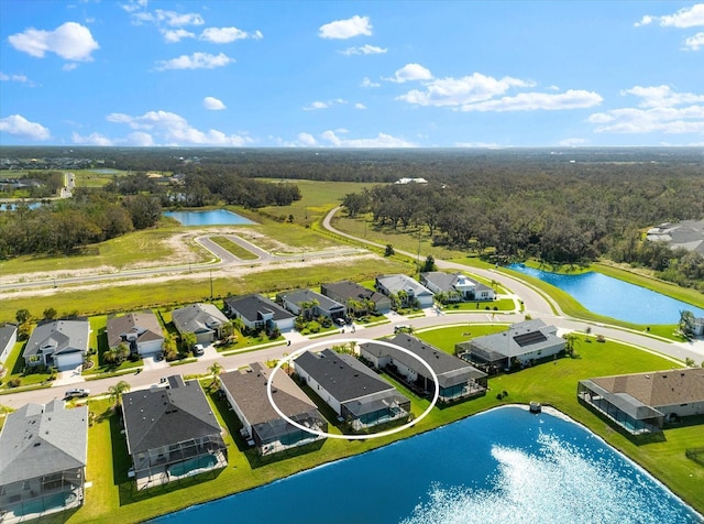 aerial view featuring a water view and a residential view