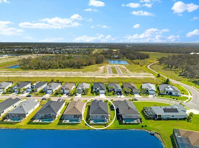 aerial view featuring a residential view and a water view