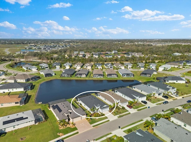 birds eye view of property with a residential view and a water view