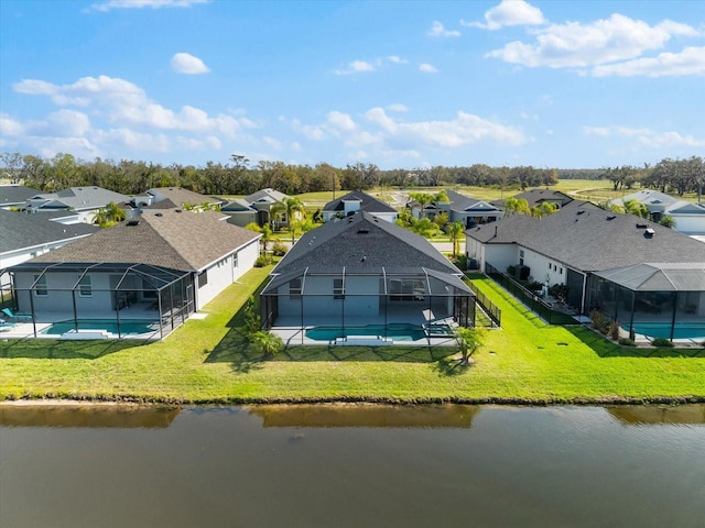 aerial view featuring a residential view and a water view