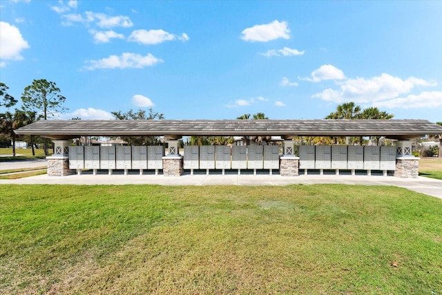 view of property's community with a lawn