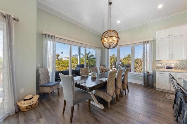 dining area featuring a chandelier, a wealth of natural light, recessed lighting, and wood finished floors