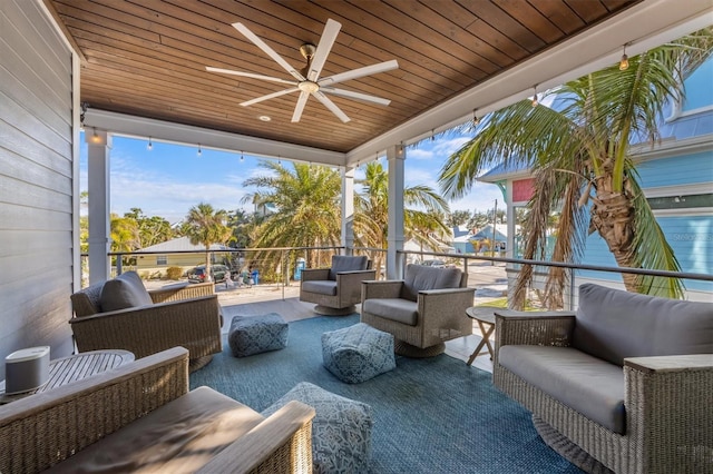 view of patio featuring outdoor lounge area, ceiling fan, and a balcony