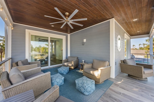 view of patio featuring an outdoor living space and a ceiling fan