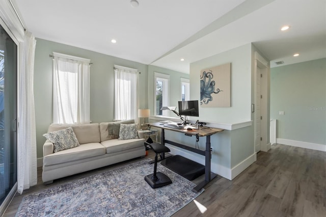 living room with a healthy amount of sunlight, baseboards, wood finished floors, and recessed lighting