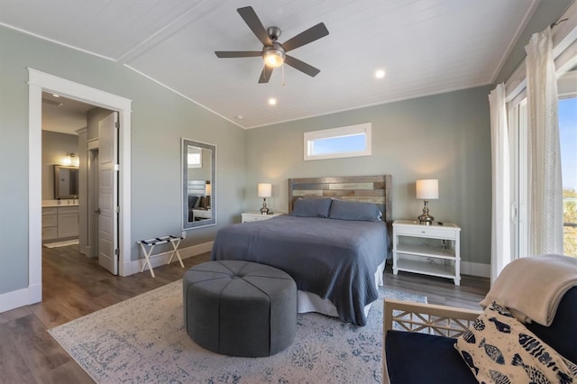 bedroom featuring recessed lighting, ensuite bathroom, ceiling fan, wood finished floors, and baseboards