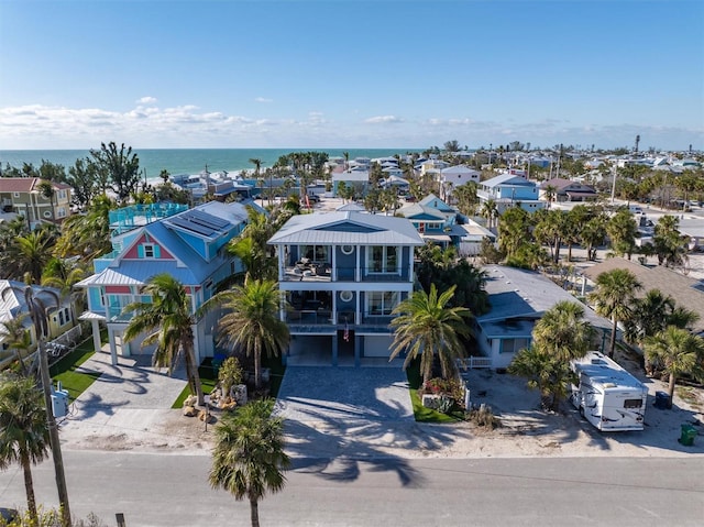 bird's eye view with a water view and a residential view