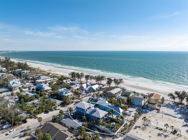 birds eye view of property with a water view, a residential view, and a view of the beach