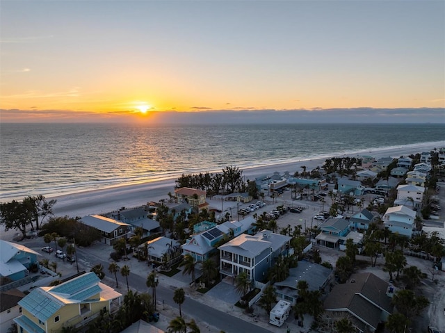 drone / aerial view featuring a water view and a beach view