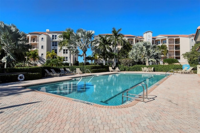 community pool with a patio area