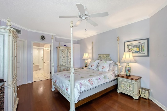 bedroom with a ceiling fan, wood finished floors, baseboards, ensuite bathroom, and crown molding