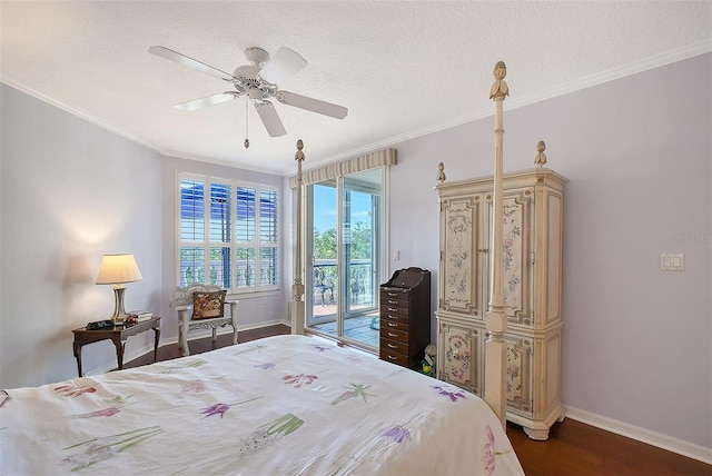 bedroom featuring a textured ceiling, ornamental molding, dark wood-style flooring, and access to outside