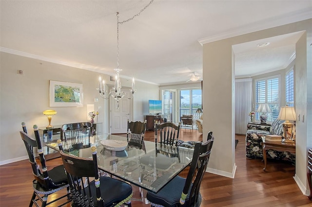 dining space featuring wood-type flooring, a healthy amount of sunlight, and ornamental molding