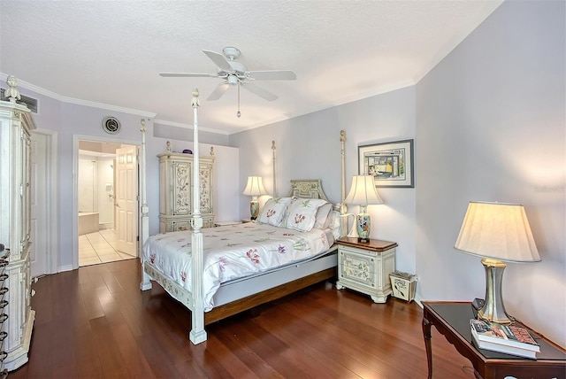 bedroom featuring visible vents, a textured ceiling, wood finished floors, and crown molding