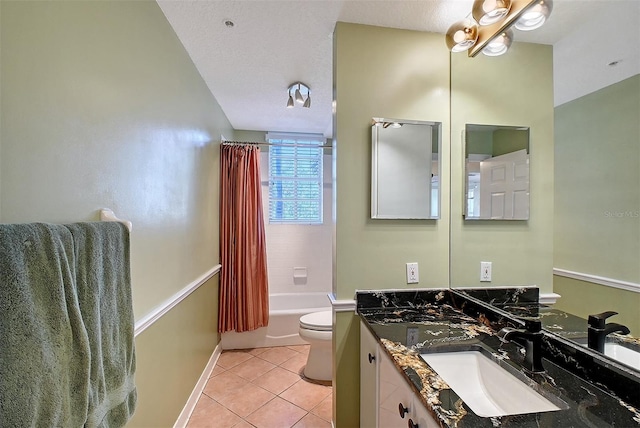 bathroom with vanity, shower / bath combination with curtain, a textured ceiling, tile patterned floors, and toilet